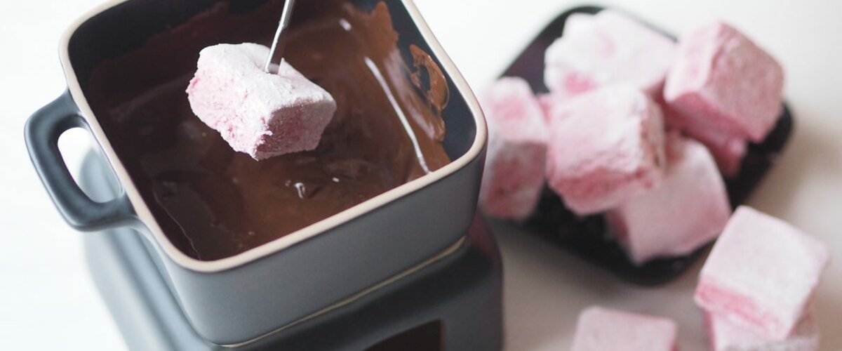 Delicious chocolate fondue with marshmallows Delicious chocolate fondue with marshmallows